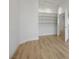 Versatile room with wood floors, built-in shelving, and an open doorway at 1978 Kachina Mountain Dr, Henderson, NV 89012