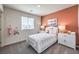 Charming bedroom features cozy decor, with bright white furniture and a fun accent wall at 220 Biscotti Ave # Lot 127, North Las Vegas, NV 89084
