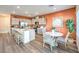 Open kitchen with gray cabinets, stainless steel appliances, and a stylish dining area, perfect for entertaining at 220 Biscotti Ave # Lot 127, North Las Vegas, NV 89084