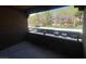 View from balcony with parking area and trees in the background at 2200 S Fort Apache Rd # 2113, Las Vegas, NV 89117