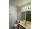 Bathroom with a shower, vanity, and a large mirror with stylish lighting fixture at 2200 S Fort Apache Rd # 2113, Las Vegas, NV 89117