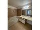 Bright bathroom featuring a shower and bath combo, vanity, tile flooring, and a large mirror at 2200 S Fort Apache Rd # 2113, Las Vegas, NV 89117