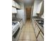Well-lit kitchen with white appliances and tile floors at 2200 S Fort Apache Rd # 2113, Las Vegas, NV 89117