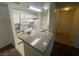 Functional kitchen featuring white appliances and stone countertops at 2200 S Fort Apache Rd # 2113, Las Vegas, NV 89117