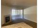 Cozy living area featuring a fireplace, carpet, and sliding glass doors at 2200 S Fort Apache Rd # 2113, Las Vegas, NV 89117