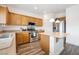 Kitchen with wooden cabinets, stainless steel appliances, and a center island at 2208 Dale Bumpers Ct, North Las Vegas, NV 89081