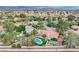Expansive aerial view showcasing the lush backyard with a pool and sport court in a well-established neighborhood at 2224 Lucerne Ct, Henderson, NV 89014