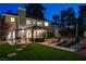 Night view of backyard, showing patio seating, and putting green at 2224 Lucerne Ct, Henderson, NV 89014