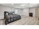 Spacious bedroom boasts wood floors, walk-in closet, and neutral tones at 2224 Lucerne Ct, Henderson, NV 89014