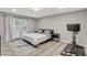 Bedroom features a patio door, modern decor, and exercise equipment at 2224 Lucerne Ct, Henderson, NV 89014