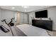 Well-lit bedroom features modern decor and exercise equipment in the space at 2224 Lucerne Ct, Henderson, NV 89014