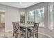 Bright dining area with large windows and modern table setup, great for Gathering meals and entertaining at 2224 Lucerne Ct, Henderson, NV 89014