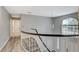 Bright hallway with stairs, a chandelier, and a view of the outdoors at 2224 Lucerne Ct, Henderson, NV 89014