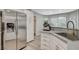 Spacious kitchen featuring stainless steel refrigerator, modern appliances, and stylish countertops at 2224 Lucerne Ct, Henderson, NV 89014