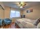 Cozy bedroom with wood floors and chair near a window at 2231 Marlboro Dr, Henderson, NV 89014