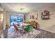 Bright dining room featuring modern chandelier, bar stand, and sliding glass doors to backyard at 2231 Marlboro Dr, Henderson, NV 89014