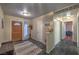 Warm entryway with dark marble floors, front door with glass, and a coat rack at 2231 Marlboro Dr, Henderson, NV 89014