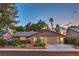Charming single-story home with a well-maintained lawn and lush landscaping, complete with a two-car garage at 2231 Marlboro Dr, Henderson, NV 89014