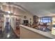 Open living room features a stone fireplace, vaulted ceilings, and hardwood flooring at 2231 Marlboro Dr, Henderson, NV 89014