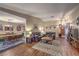 Open concept living and dining areas featuring hardwood floors and cozy furnishings at 2231 Marlboro Dr, Henderson, NV 89014