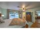 Relaxing main bedroom features a ceiling fan, backyard views, and ensuite access at 2231 Marlboro Dr, Henderson, NV 89014