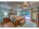 Comfortable main bedroom features a ceiling fan and sliding glass doors to the pool area at 2231 Marlboro Dr, Henderson, NV 89014
