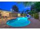 Sparkling pool area featuring a basketball hoop, lounge chairs, and a covered patio with an outdoor dining set at 2231 Marlboro Dr, Henderson, NV 89014