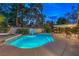 Backyard pool area featuring a basketball hoop and an outdoor lounge area, perfect for relaxation and recreation at 2231 Marlboro Dr, Henderson, NV 89014