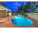 Beautiful pool with a charming deck, perfect for lounging, surrounded by a lush garden with meticulous landscaping at 2231 Marlboro Dr, Henderson, NV 89014