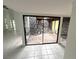 A spacious indoor atrium with brick flooring and natural stone accents, providing natural light at 2480 Domingo St, Las Vegas, NV 89121