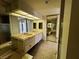 Bathroom featuring double sinks, generous mirror, and closet at 2480 Domingo St, Las Vegas, NV 89121