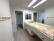 Bathroom featuring vanity with sink, generous mirror, and tile flooring at 2480 Domingo St, Las Vegas, NV 89121