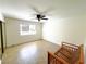 Bedroom with tile flooring, a ceiling fan, and sliding door closet at 2480 Domingo St, Las Vegas, NV 89121
