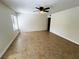 Bedroom with tiled floors, ceiling fan, and window with blinds at 2480 Domingo St, Las Vegas, NV 89121