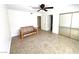 Spacious bedroom features tiled floors, a ceiling fan, and a sliding door closet at 2480 Domingo St, Las Vegas, NV 89121