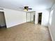 Spacious bedroom featuring tiled floors, ceiling fan, and mirrored closet doors at 2480 Domingo St, Las Vegas, NV 89121