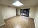 A room with tile floor and a skylight, with a view to a covered patio with rocks at 2480 Domingo St, Las Vegas, NV 89121