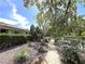 Landscaped common area featuring desert plants and a tranquil walking path at 2480 Domingo St, Las Vegas, NV 89121