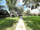 Mature trees line the common area of this HOA community at 2480 Domingo St, Las Vegas, NV 89121