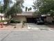 Charming single-story home featuring a tile roof, desert landscaping, and a two-car garage at 2480 Domingo St, Las Vegas, NV 89121