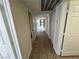 Long hallway with tiled floors and white doors at 2480 Domingo St, Las Vegas, NV 89121