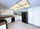 Bright eat in kitchen with white cabinetry, stone countertops, and stainless steel appliances at 2480 Domingo St, Las Vegas, NV 89121