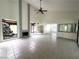 Open living room features a fireplace, wet bar, and atrium views, creating a bright and airy space at 2480 Domingo St, Las Vegas, NV 89121