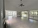 Bright living room features a ceiling fan and tiled flooring with lots of natural light at 2480 Domingo St, Las Vegas, NV 89121
