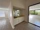 Living room with a built in bar and view of a sunroom filled with natural light at 2480 Domingo St, Las Vegas, NV 89121