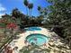 Dual community pools and spa surrounded by tropical plants and landscaping at 2480 Domingo St, Las Vegas, NV 89121