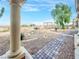 A beautiful backyard with gravel landscaping, a fountain, and a paved walkway at 2540 Faiss Dr, Las Vegas, NV 89134