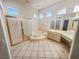 Bright bathroom featuring a glass shower, a spa bath, and a double vanity at 2540 Faiss Dr, Las Vegas, NV 89134