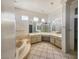 Spacious bathroom featuring an oversized tub, dual sinks, and luxurious fixtures at 2540 Faiss Dr, Las Vegas, NV 89134