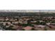 City view featuring houses with tile roofs and the skyline in the distance at 2540 Faiss Dr, Las Vegas, NV 89134